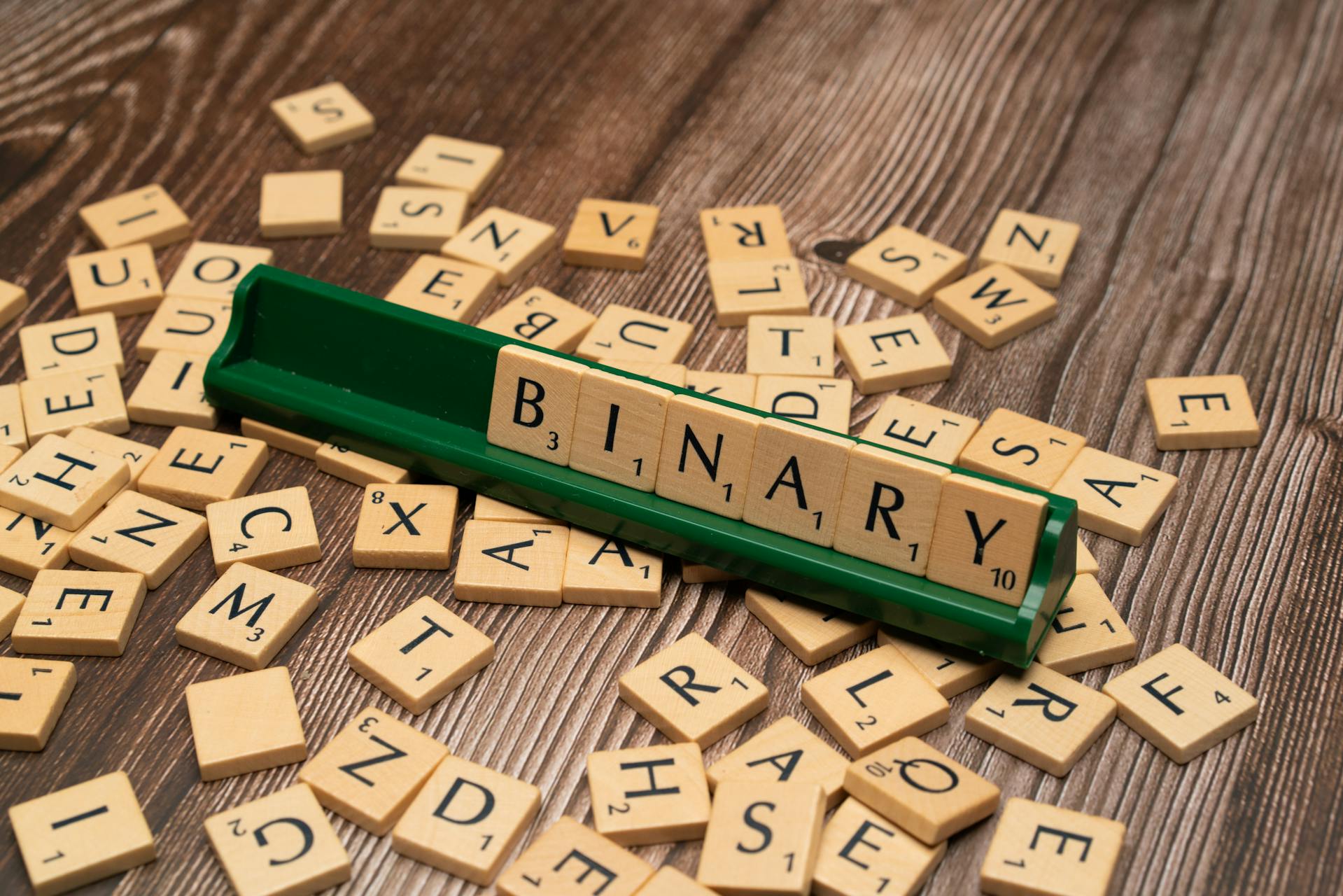 Binary code digits flowing across screen representing file format reverse engineering